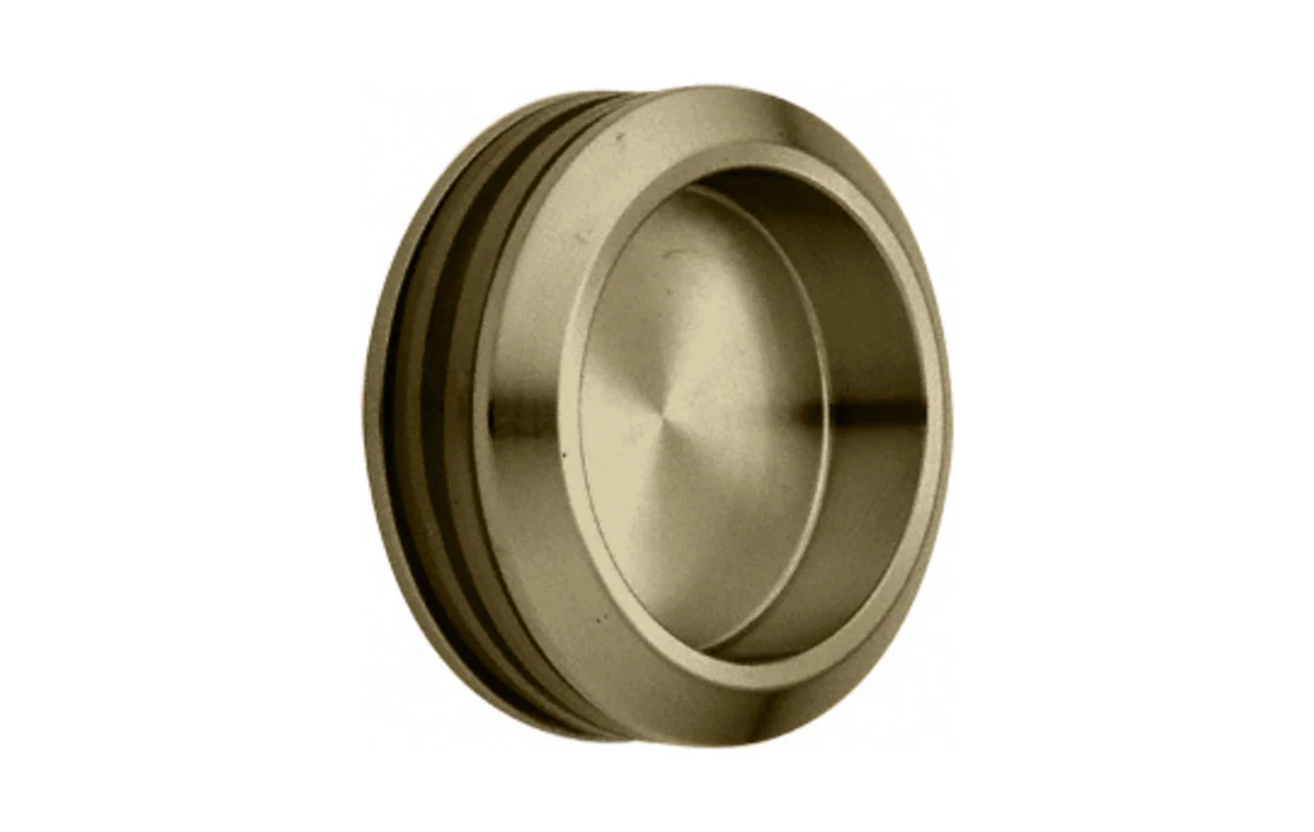 Brushed bronze round finger pull hardware example.