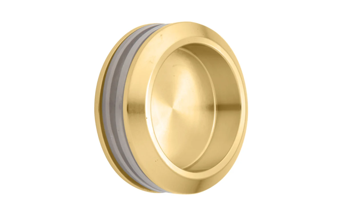 Satin brass round finger pull hardware example.